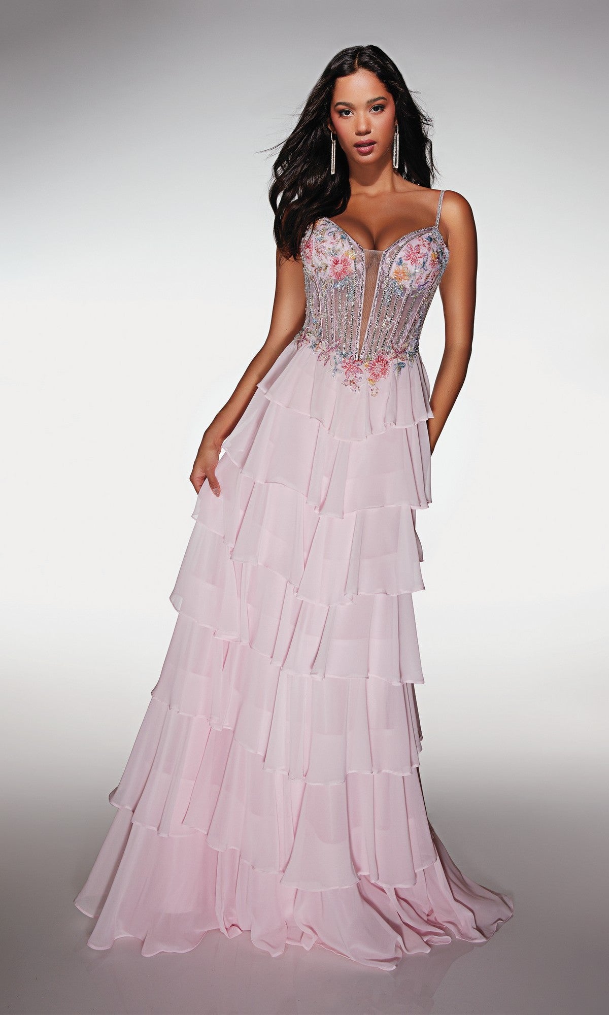 A woman models the Long Prom Dress: Alyce 61993—pastel chiffon with a tiered ruffle skirt, spaghetti straps, and a beaded, floral-embellished bodice—posing against a plain background.